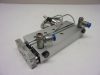 Rexroth GPC-DA-010-0075-BV-BB, R402000327, Vezetett pneumatikus munkahenger, precíziós lineáris egység, dugattyú Ø 10mm, lökethossz 75mm, 2db. SMC D-F9P szenzorral, és 4mm-es push-in gyorscsatlakozós áramlásszabályozókkal Rexroth GPC-DA-010-0075-BV-BB, R402000327, Vezetett pneumatikus munkahenger, precíziós lineáris egység, dugattyú Ø 10mm, lökethossz 75mm, 2db. SMC D-F9P szenzorral, és 4mm-es push-in gyorscsatlakozós áramlásszabályozókkal
