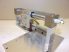 SMC CY3R10-100 hajtókar nélküli, mágneses csatolású pneumatikus lineáris egység, 100mm lökethossz, 2db. SMC D-M9P szenzorral, Rexroth profilsínnel és kocsival, és 4 mm-es push-in csatlakozós áramlásszabályozókkal,